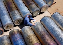 A Perryman Company worker takes inventory of titanium stock. Apple Boosts US Manufacturing with New Partners for iPhone Duo and iPhone 18 Pro